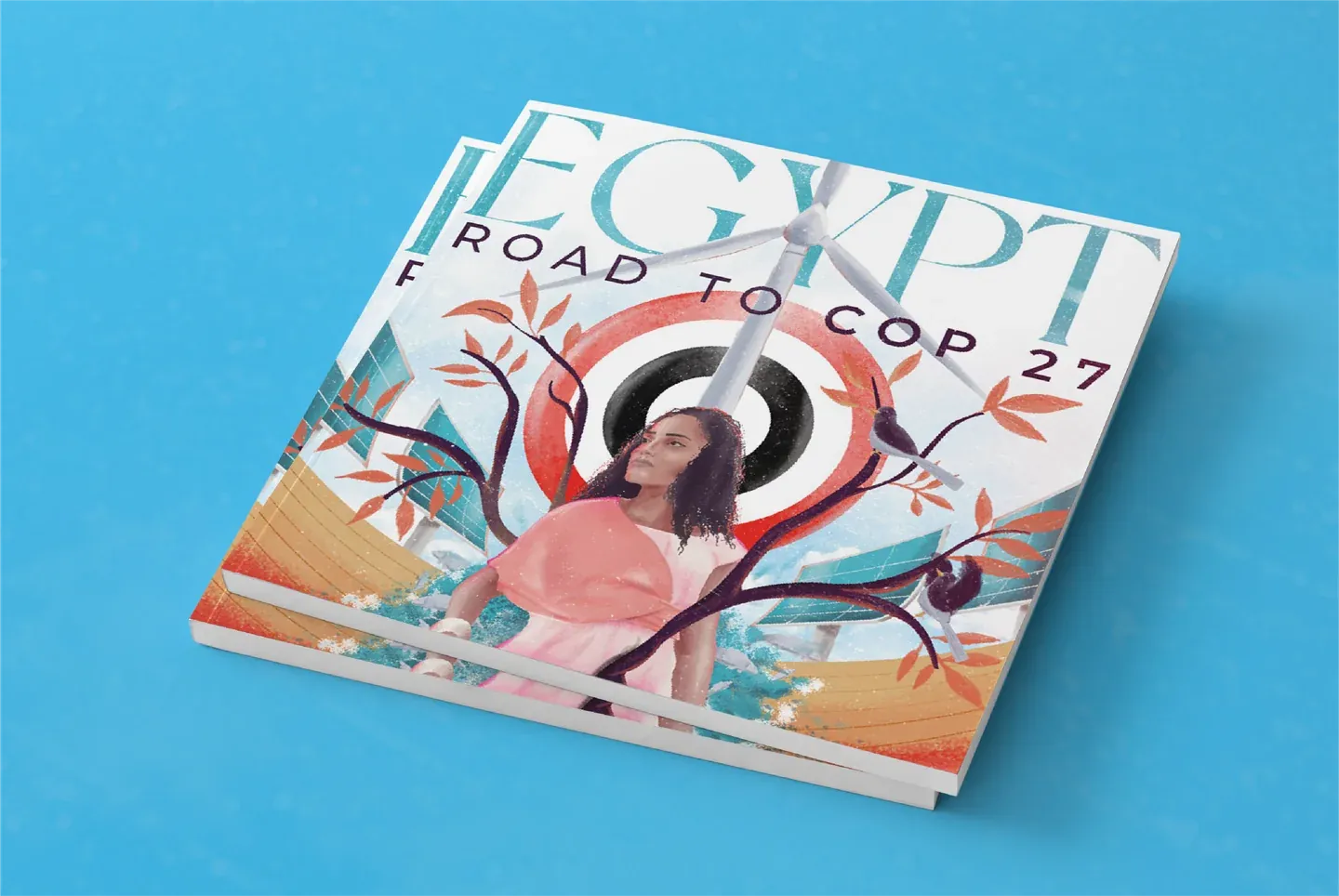 Egypt Road to COP27 magazine cover mockup with an illustrated woman, branches and pale typography on cyan