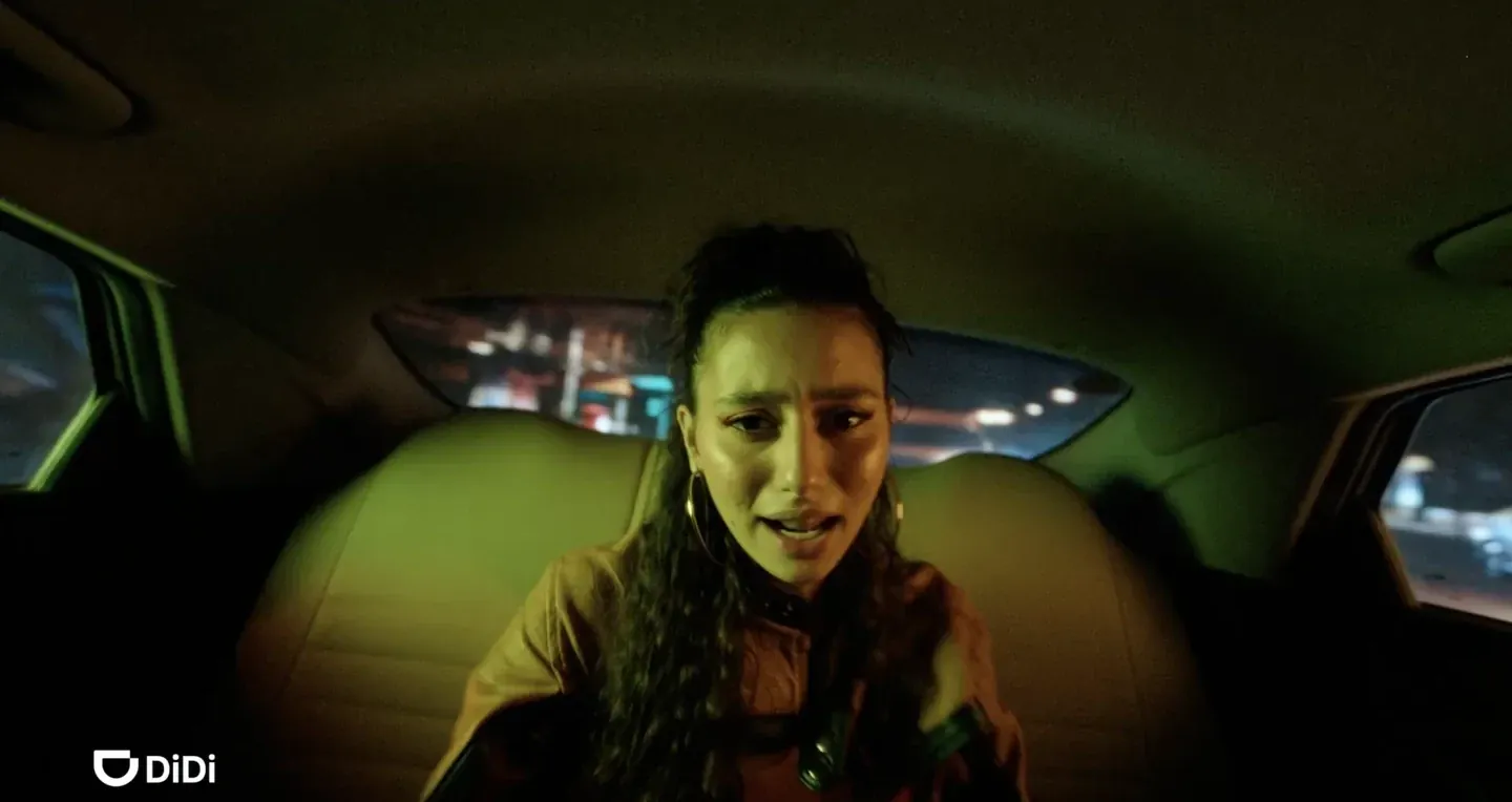 DiDi supplied real storyboard frame of a woman in the back of a car at night